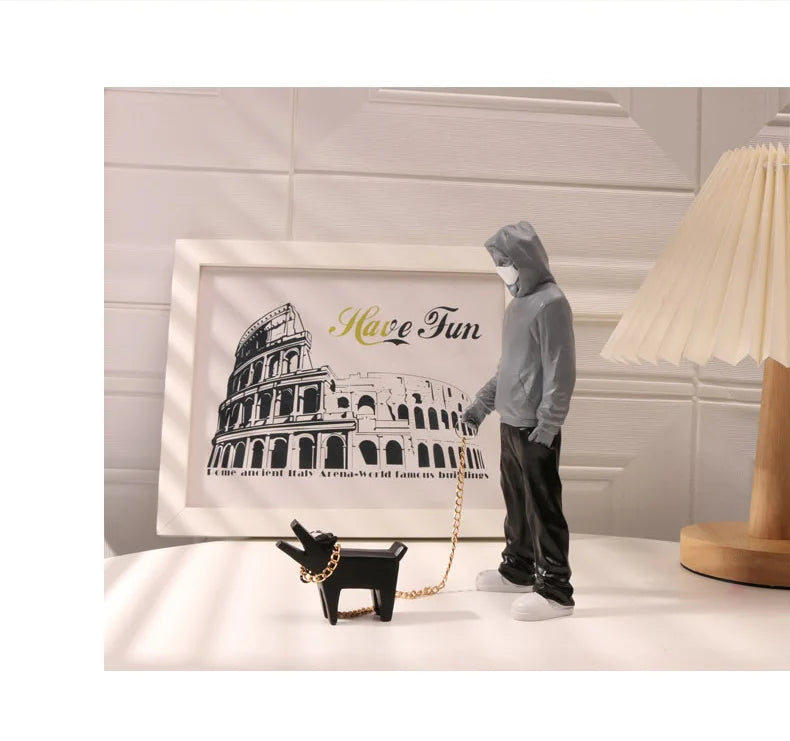 Hooded Man & Dog Figurine