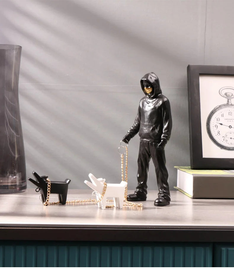 Hooded Man & Dog Figurine