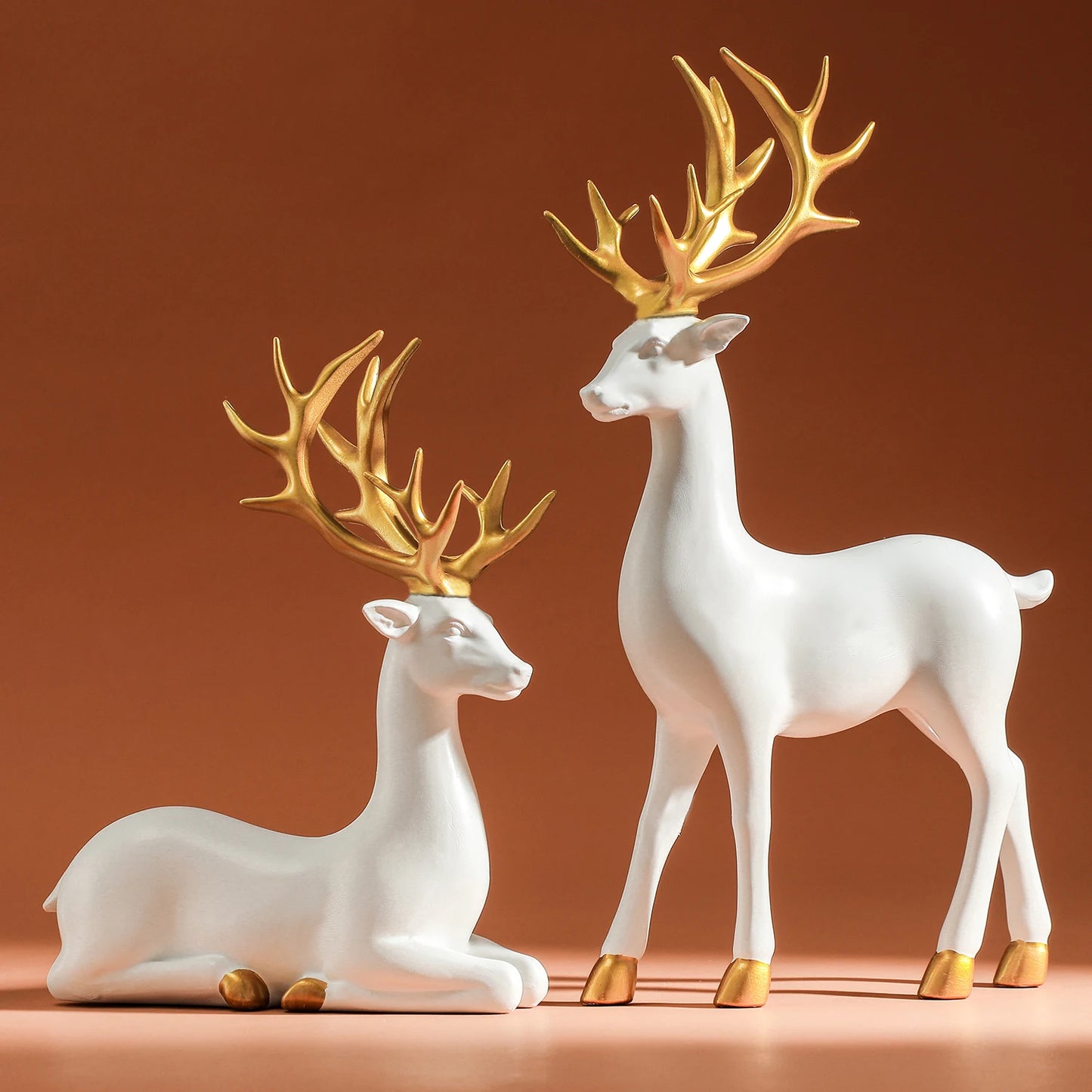 Majestic White and Gold Reindeer Figurines