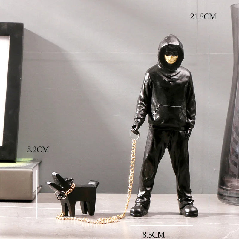 Hooded Man & Dog Figurine