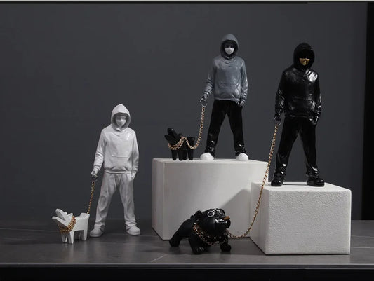 Hooded Man & Dog Figurine